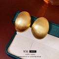 Vintage matgouden ovale oorknopjes met een elegante Franse metalen textuur - Goud