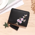 Black small zip wallet for women with floral embroidery and star tassel charm detail - Black