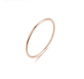Macro shot of polished rose gold thin band ring with a glossy finish on a white surface - US 4 / Rose Gold-1mm-Round