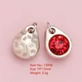 Red crystal teardrop pendant in silver alloy base with hammered texture back finish - Silver Teardrop Red Rhinestone Pendant