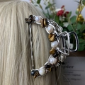 Silver metal hair claw clip with white pearls and brown tiger eye stones on blonde hair - Tiger Eye Deep Sea Pearl Silver Hair Claw