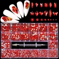 Macro detail of 21-compartment red crystal nail rhinestones set with dual-end dotting tool - Red Set / 21 Grids/600 Large+2500 Flatback