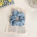 Blue and white gingham checkered scrunchie hair tie with elegant fabric folds - Ocean Dark Grid