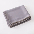 Detail view of smooth grey satin scarf featuring elegant gold bead chain trimming on the edge - Gray / 175cm