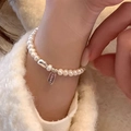 Elegant s925 silver pearl bracelet featuring a polished lucky square tag on a soft background - 925 Silver / C98 Pearl Bracelet - Silver