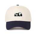 Close-up of a panda embroidery detail on a two-tone beige and navy baseball cap - Adjustable / Navy Blue