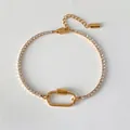 Bracelet tennis en acier inoxydable doré 14K avec maillon ovale et zircons - Style Tennis Strass Or 14K (XBL0064-2)