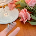 Silver cross earrings with sparkling zircons and delicate chains on pink rose background - Silver Cross Chain