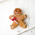 Gingerbread man Christmas ornament with pink bow and candy cane details, 11.5cm hanging decor - Gingerbread Man Shape