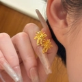 Elegant gold-plated palm tree earrings set with a French floral jewelry aesthetic - Earrings / Gold