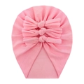Close-up of pink soft cotton baby hat featuring a stylish triple bow detail on white background - Pink