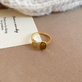 Detailed close-up of golden crossover ring featuring oval tiger eye stone and small metal disc - Adjustable Open / Gold-Coffee (Single Stone Disk)