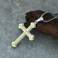 Macro shot of two-tone gold and silver cross pendant with Lord's Prayer engraving on wood - Pendant Only / Silver/Gold Two-Tone Pendant (No Chain)