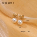Elegant gold bow pearl earrings with drop pendant on orange silk background - Minimalist Bow Pearl Drop Studs (NMSE-C541-1)