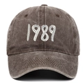 Close-up of vintage washed cotton baseball cap featuring 3D embroidered 1989 text detail - Coffee