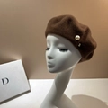 Detail view of brown wool beret with pearl and gold bead accents on a studio head model - M (56-58cm) / Coffee