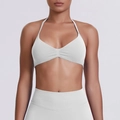 Close-up of white halter sports bra with gathered front and high-waisted yoga leggings set - Feather Beige