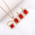 Elegant gold bridal jewelry set with square red stones and clear diamond accents - Three-Piece Set / Square-Red