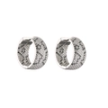 Detailed view of silver hoop earrings featuring micro-pave white and black cubic zirconia - Wide Full Diamond Leopard / Silver