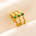 Macro detail of triple-band gold ring featuring three round green malachite stones - Triple Layer Beaded / Gold Green