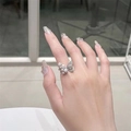 Detail of a 925 sterling silver butterfly ring with pearls and rhinestones on model - Silver Butterfly Pearl (JZ0715)