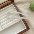 Detail of U-shaped hair pin in pearlescent acetate within a premium jewelry box - Mermaid White
