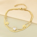 Detail of double-layer gold anklet with flower charms on elegant silk background - Three Flowers Pendant Style (KJ4231-SXSJ)