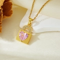 Detail of gold lock necklace with pink heart crystal on white textured background - Gold Pink Zircon Lock Heart Necklace (T021)