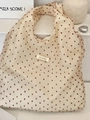 Close-up detail of cream organza tote bag featuring red polka dots and Sorekka brand label - Organza Red Polka Dot