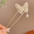 Elegant gold butterfly hair pin with sparkling crystals and a white teardrop pearl pendant - Butterfly Pearl Hair Stick