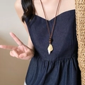 Detail of bohemian necklace featuring a natural cream shell pendant and dark cord strap - Coffee Shell Conch Style (25#)