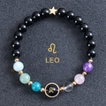 Detail of Leo zodiac bead bracelet with gold star pendant and colorful beads on dark background - Leo-Obsidian