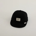 Detail of soft cotton baby baseball cap showing black fabric texture and square brand patch - Baby 2-5 Years 50-52CM / Black