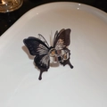 Macro detail of silver-tone butterfly open ring with translucent black wings on white - Small Butterfly Open Style