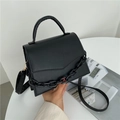 Minimalist black faux leather crossbody bag with top handle and decorative chunky chain - Black