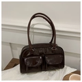 Detail of dark brown glossy patent leather handbag with dual front flap pockets - Coffee