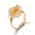 Handmade citrine raw gemstone ring with golden wire wrap on white background - Citrine