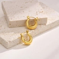 Chic golden hollow hoop earrings for women displayed on a natural stone minimalist background - 15mm / Gold