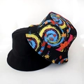 Detail showing the reversible bucket hat with black solid side and galaxy maple leaf pattern - Blue Swirl Print
