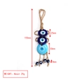 Close-up of blue glass Evil Eye pendant with rope showing measurements of 155mm length - Multiple Round Beads Style