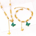 Golden butterfly and pearl jewelry set featuring a necklace and matching bracelet - Necklace + Bracelet