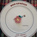 Pink handmade crochet flower with yellow center and green leaf accessory, 4.5cm x 5cm size - Pink Peach Blossoms