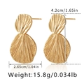 Detail view of double heart layered earrings in 18K gold plating with size dimensions - Folded Irregular Leaf - Gold (KE1045)
