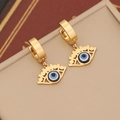 Golden evil eye hoop earrings with blue enamel charms on a beige jewelry box display - Oval Eyelash Eye (4#)