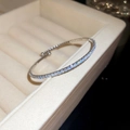 Close-up of a silver tennis bracelet with brilliant cubic zirconia in a jewelry box - Silver