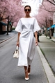 Chic white cotton tie-waist dress with wide sleeves shown in a cherry blossom street view - S / White