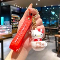 Adorable Sanrio Hello Kitty in a tea cup keychain charm with a red wrist strap handle - White Cup Hello Kitty (B474-2) / Single Piece