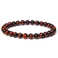 Macro detail of polished red tiger eye stone beads on a stretch bracelet with glossy finish - 6mm Red Tiger Eye