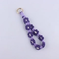 Detail of a handmade woven daisy keychain with purple cotton rope and gold ring clasp - Lilac Purple
