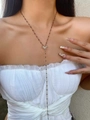 Rose gold Y-shaped necklace with starburst pendant and black bead accents on model - Gold Chain Black Beads with Starburst Pendant